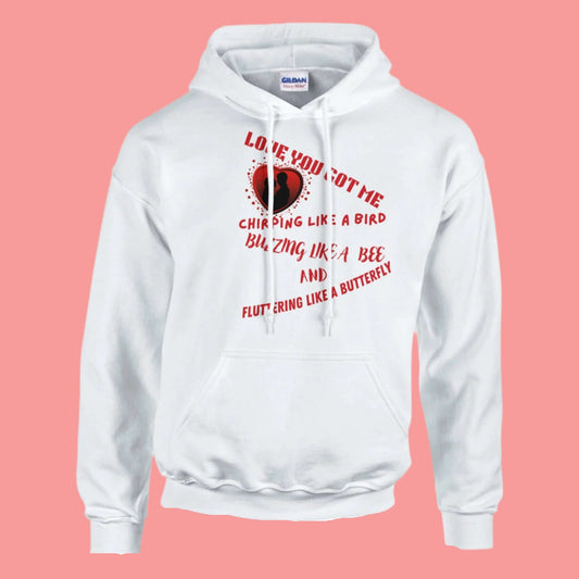 Love You Got Me Chirping unisex pullover hoodie featuring a heart graphic and playful text on a white background.
