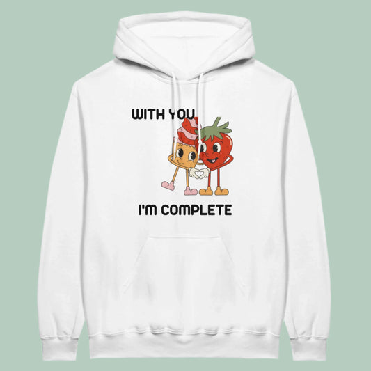 White hoodie with cartoon strawberries and text 'With You I'm Complete' for a cozy casual look.