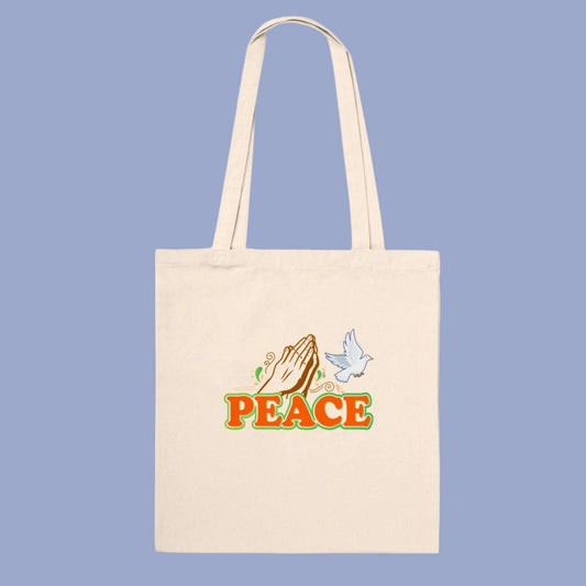 Tote bag with the word peace a dove and praying hands
