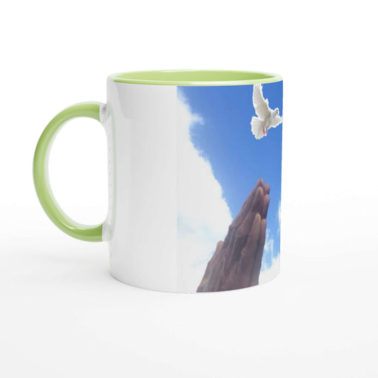 white and mint green ceramic mug with a white dove and claps hands symbolize prayer